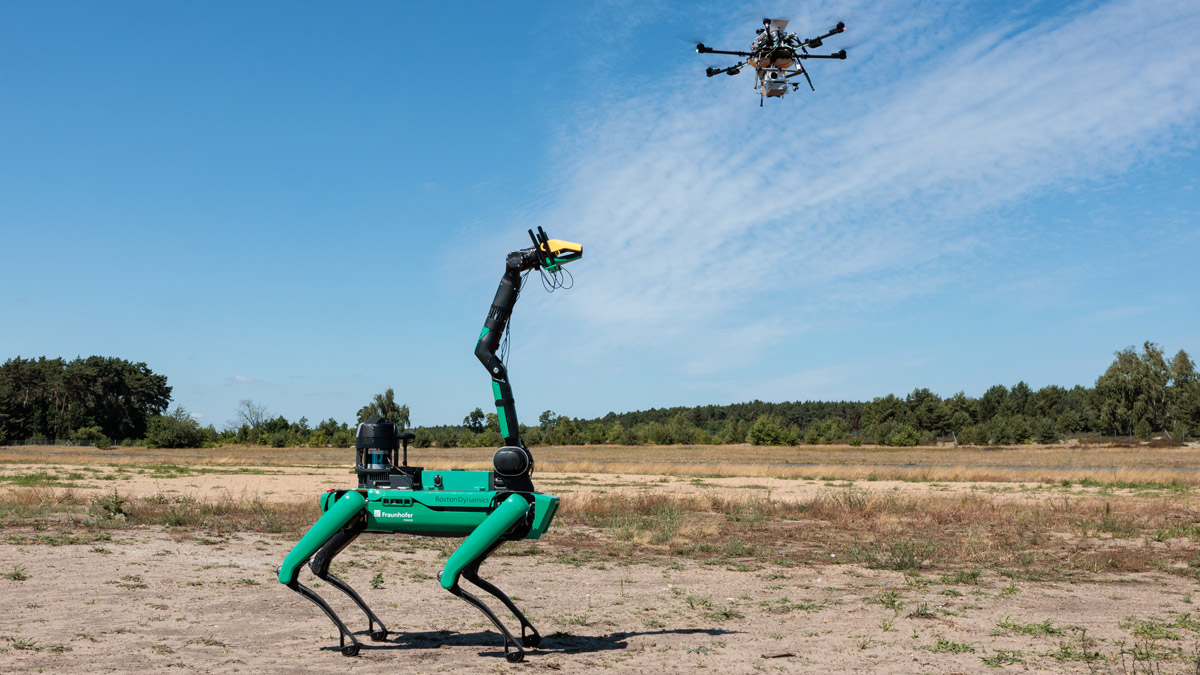 Quadruped robot and drone operating in a shared outdoor environment, illustrating 5G/6G networking for Physical AI, autonomous systems and cyber-physical coordination.